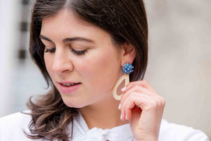 Model is wearing Ava Blue Rattan Teardrop Earrings_m donohue collection