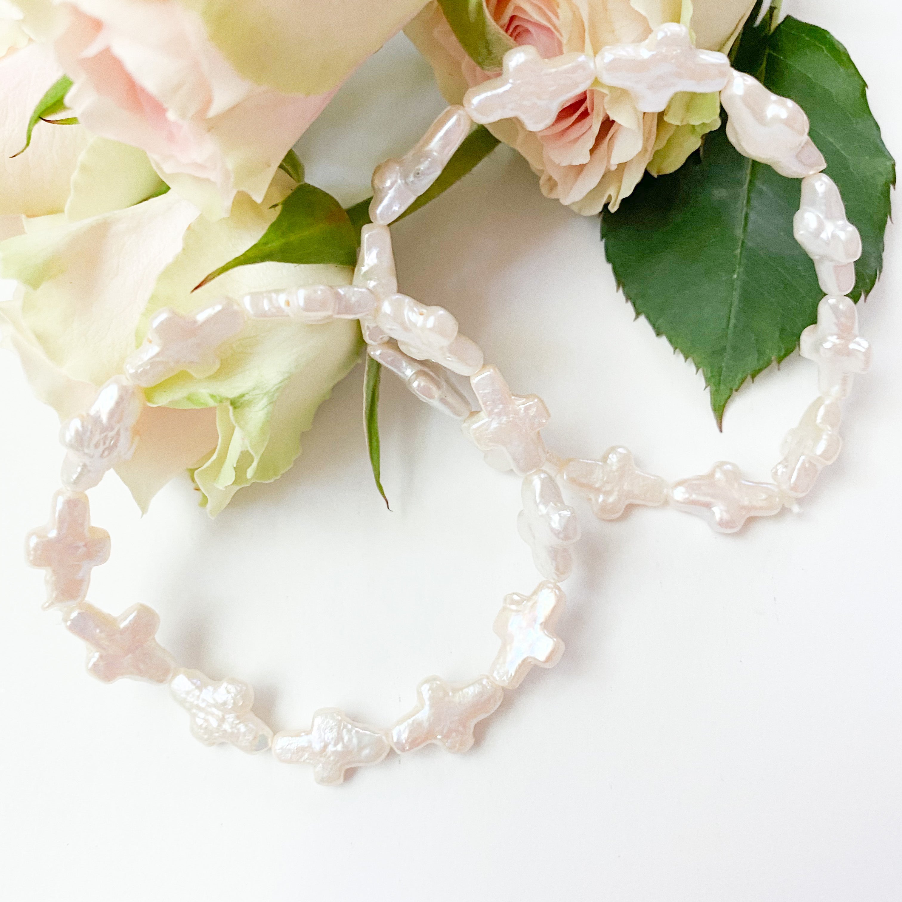 Little Cross Stretch Bracelets displayed with roses_m donohue collection