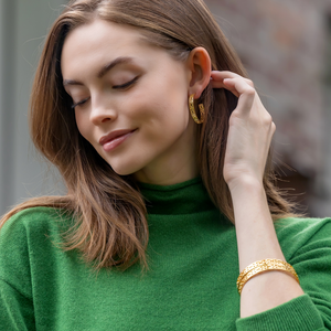 Model is wearing Maison Treillage Gold Hoop Earrings_m donohue collection