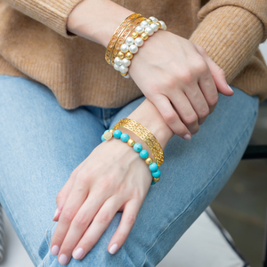Model wears Versailles Treillage bangle with Lauren multi turquoise and olivia multi gold bracelets_m donohue collection