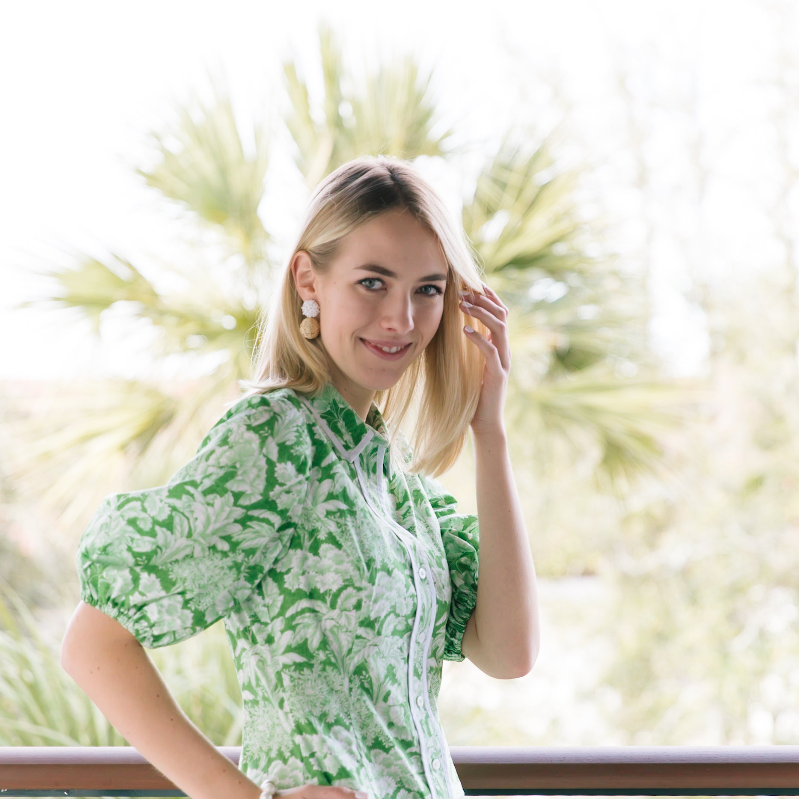 Model is wearing Liz White Rattan Ball Earrings_m donohue collection