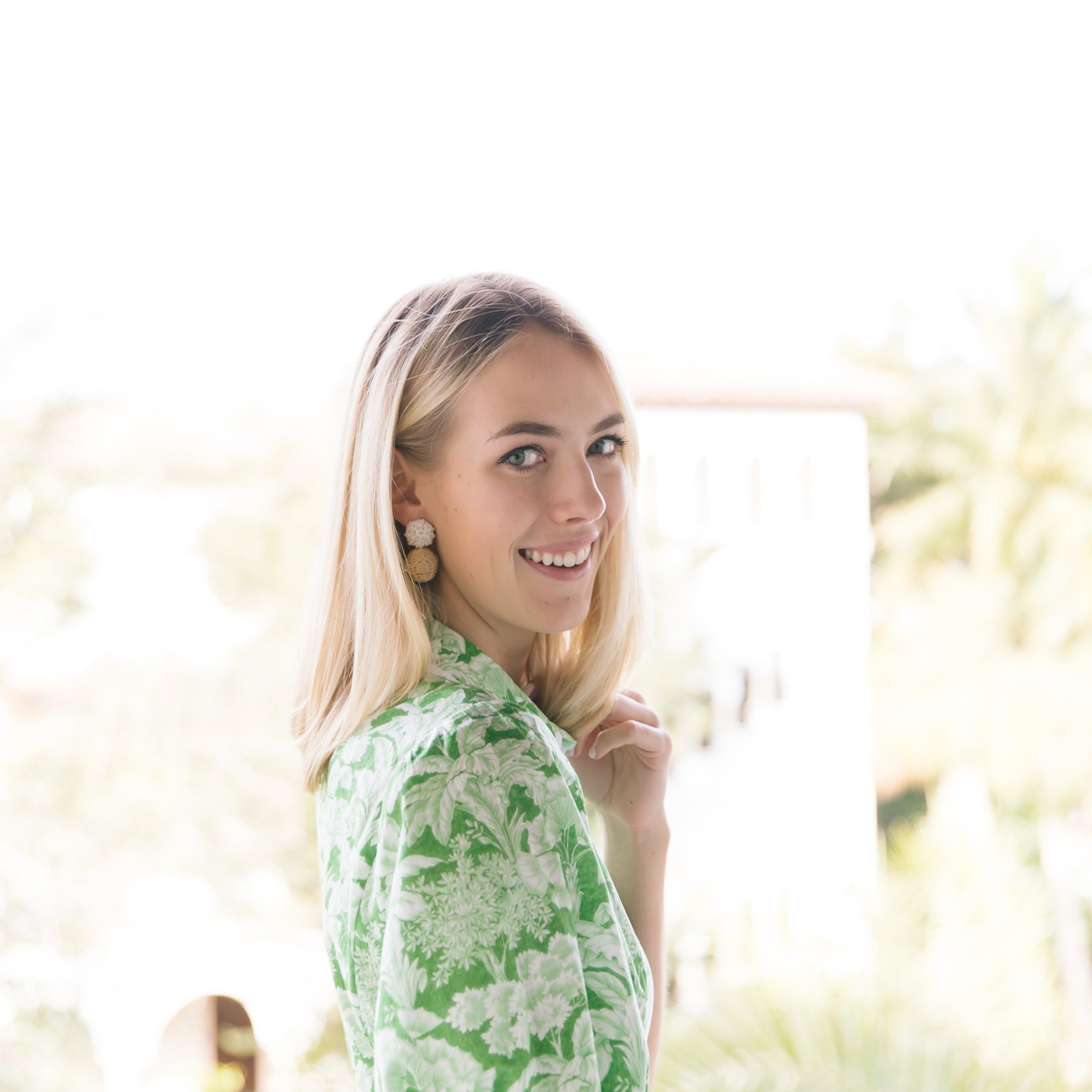 Model is wearing Liz White Rattan Ball Earrings_m donohue collection