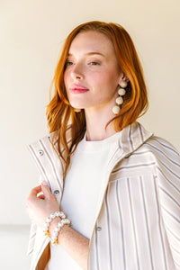 Model wears Grace Rattan Mini Triple earrings_m donohue collection