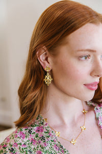 Model wears the Bloom Floral Cluster earrings_m donohue collection
