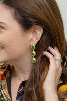 Model wearing Emerald Gemstone Triple Earrings_M Donohue Collection