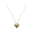 Gold heart-shaped pendant necklace on a white background_m donohue collection