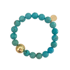 Beautiful stretch bracelet with blue turquoise color beads and single gold plated copper bead_m donohue collection