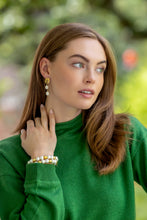 Load image into Gallery viewer, model wearing gold post earrings with double pearl drops_ m donohue collection