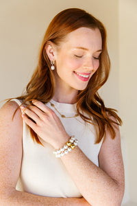 Model is wearing the Remy Wicker Necklace with Remy White Pearl Drop Earrings_m donohue collection