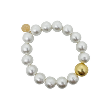 Stretch bracelet with lightweight vintage style cotton pearls and single gold-plated copper bead_m donohue collection