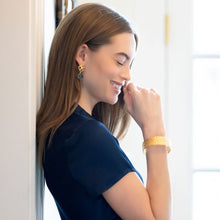 Load image into Gallery viewer, model wearing Avignon gold wicker and blue quartz gemstone earrings with gold Jardin bangle bracelet_m donohue collection 