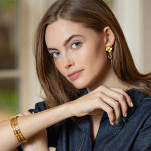 Model is wearing Versailles Treillage Gold Bangle_m donohue collection