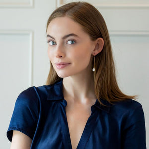 Model is wearing Holly Gold Pearl earrings_m donohue collection