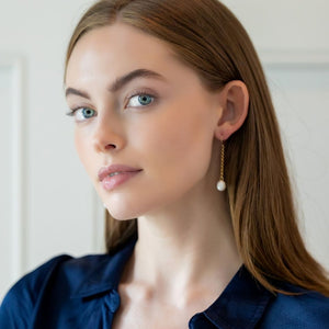 Model is wearing Holly Gold Pearl earrings_m donohue collection