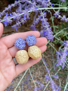 Delicate purple flower cluster posts with woven rattan ball_m donohue collection