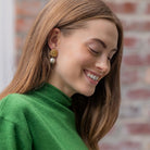 Model is wearing Jardin Hydrangea Gold Single Cotton Pearl Earrings_m donohue collection