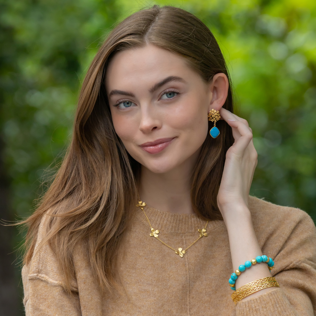 Model wears Jardin Hydrangea Turquoise Drop earrings_m donohue collection