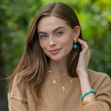 Load image into Gallery viewer, Model wears Jardin Hydrangea Turquoise Drop earrings_m donohue collection