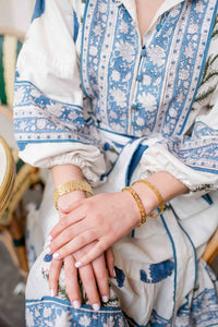 Model is wearing Maison Treillage Gold Bangle with the Versailles Treillage and Jardin Gold Bangles_m donohue collection
