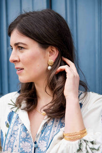 Model is wearing Jardin Hydrangea Gold Single Cotton Pearl Earrings_m donohue collection