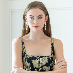 Model is wearing Liz Cotton Pearl Triple White Earrings_m donohue collection