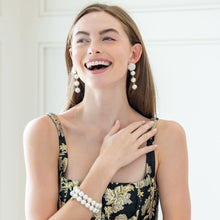 Load image into Gallery viewer, Model is wearing Liz Cotton Pearl Triple White Earrings_m donohue collection