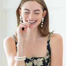 Load image into Gallery viewer, Model is wearing Liz Cotton Pearl Triple White Earrings_m donohue collection