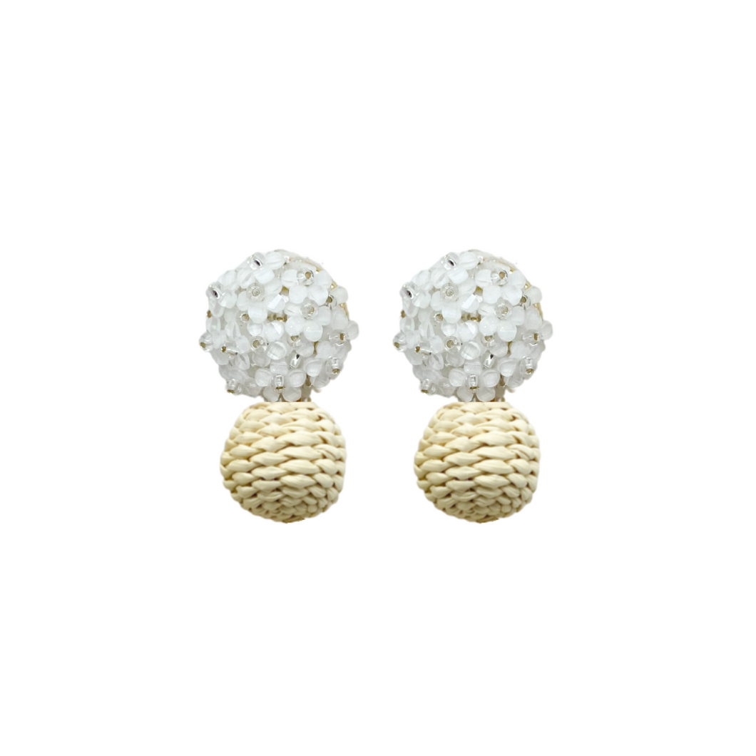 Delicate white flower cluster posts with woven rattan ball_m donohue collection