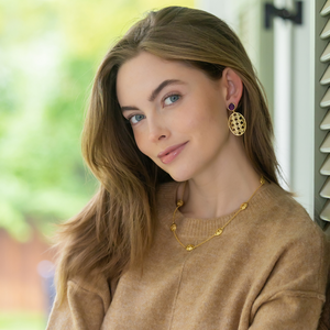 Model wears Remy Wicker Gold Oval & Amethyst Gem Earrings_m donohue collection
