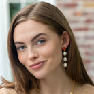 Model wears Triomphe Carnelian & Triple Cotton Pearl Earrings_m donohue collection