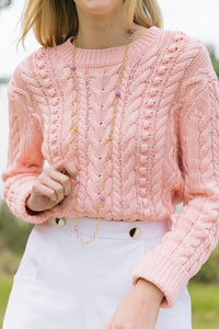 Model wears long Annabelle Gold and Lilac gemstone necklace with sweater_m donohue collection