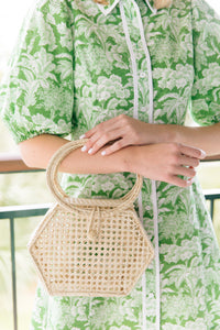 Model is carrying Summer Woven Handbag_m donohue collection