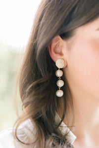 Model wears Grace Triple Cotton Pearl earring_m donohue collection