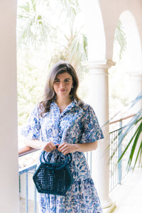 Model is carrying Summer Woven Handbag in Navy_m donohue collection