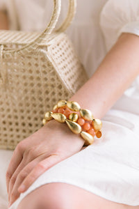 Model wears Lauren Tangerine Bracelet with Caroline Gold and Miller Gold Bracelets_m donohue collection