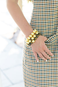 Model is wearing Lauren Tiger Eye Bracelet with Pamela Gold Bracelets_m donohue collection