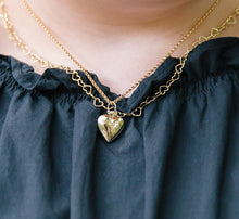 Load image into Gallery viewer, Model wears Dana Gold Heart Locket with Little Gold Hearts Necklace_m donohue collection