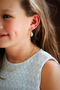 Model is wearing Little Cross Earrings_m donohue collection