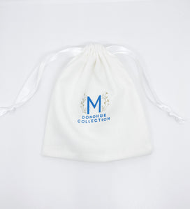 M Donohue Collection branded pouch._m donohue collection
