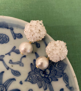 Liz Cotton Pearl White Earrings displayed on blue porcelain_m donohue collection