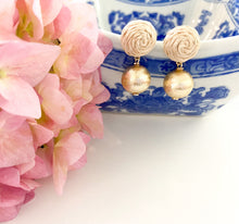 Load image into Gallery viewer, Grace Rattan Gold Ball earring displayed with pink florals and blue porcelain dish_m donohue collection