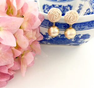 Grace Rattan Gold Ball earring displayed with pink florals and blue porcelain dish_m donohue collection