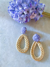 Load image into Gallery viewer, Ava Lavender Rattan earring displayed with purple floral_m donohue collection