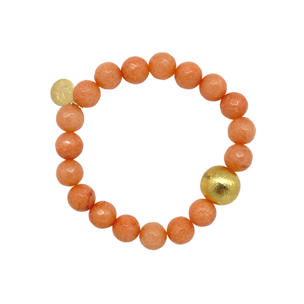 Stretch bracelet with orange jade gemstones and gold plated copper bead_m donohue collection
