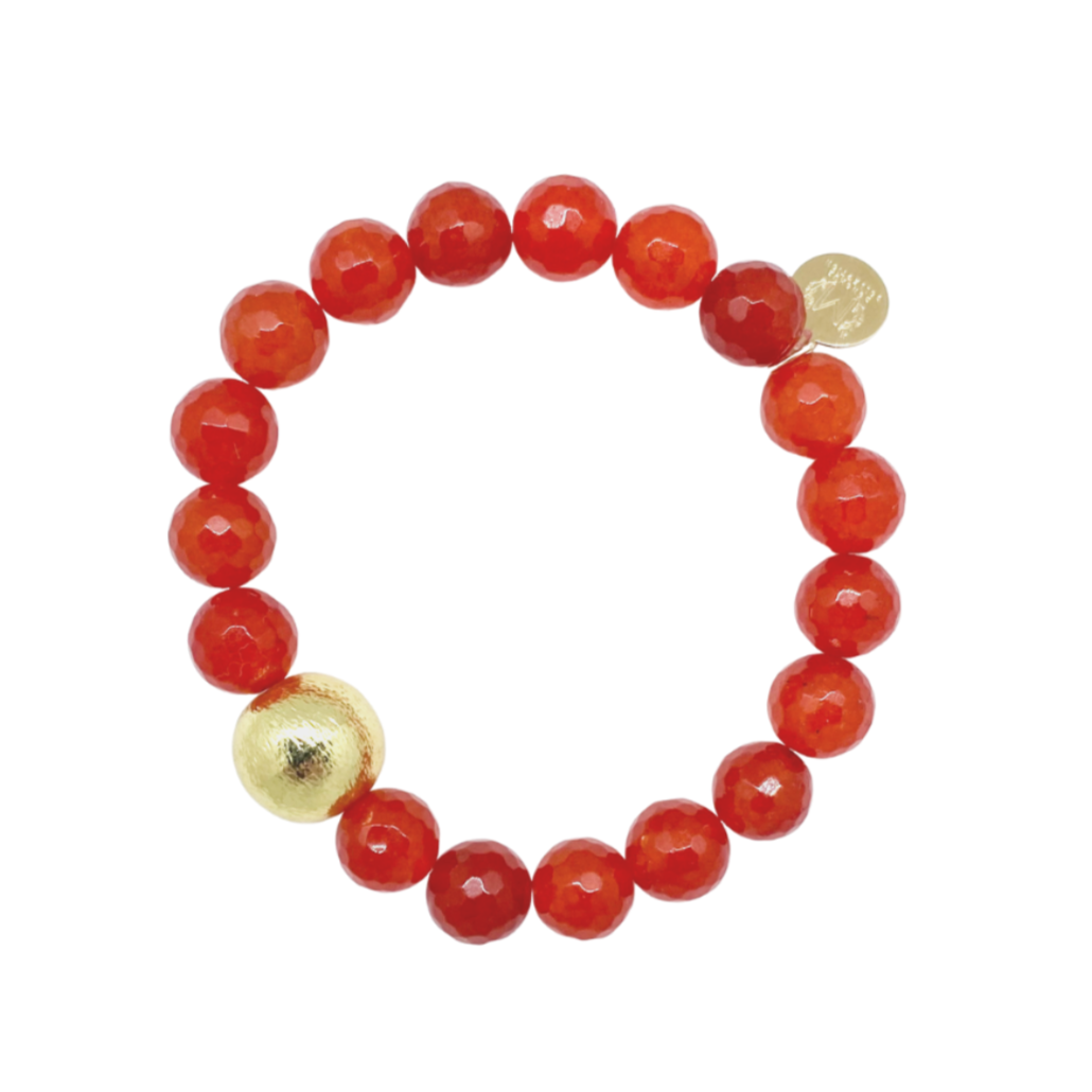 Beautiful stretch bracelet with dark orange jade beads and single gold plated copper bead_m donohue collection