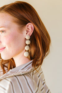 Model wears Grace Rattan Mini Triple earrings_m donohue collection