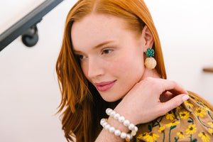 Model is wearing Liz Green Rattan Ball Earrings_m donohue collection
