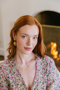Model wears the Bloom Floral Cluster earrings_m donohue collection