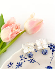 Load image into Gallery viewer, Audrey Porcelain Earrings displayed on blue and white china with pink tulips_m donohue collection