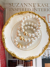 Load image into Gallery viewer, Olivia Cotton Pearl &amp; Gold Bracelet displayed on gold accented china dish_m donohue collection